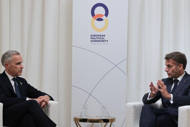 France's President Emmanuel Macron and Canada's Prime Minister Mark Carney hold a meeting on the sidelines of the 8th European Political Community (EPC) summit in Yerevan on May 4, 2026. (Photo by Ludovic MARIN / AFP)