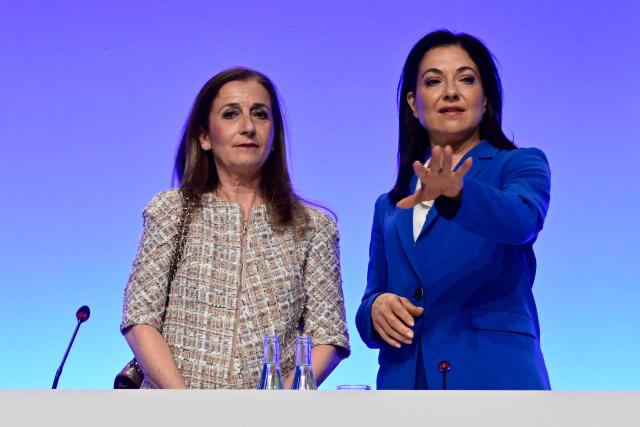 German Economy and Energy Minister Katherina Reiche (R) speaks with the President of the Economic Council of the Christian Democratic Union (CDU) Astrid Hamker during the economic policy summit (Wirtschaftstag) in Berlin on May 4, 2026. The two-day summit brings together key players from politics and business. (Photo by John MACDOUGALL / AFP)