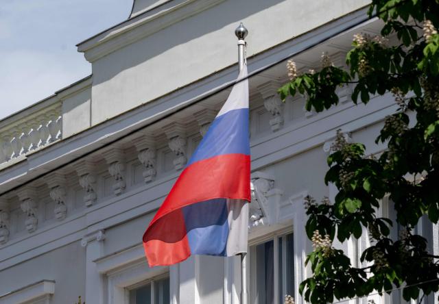 A Russian flag flies in front of the Embassy of the Russian Federation is seen in Vienna, Austria on May 4, 2026. Austria said it had expelled three Russian embassy staff on suspicion of spying, with the foreign minister vowing a "change of course" and a crackdown on espionage. The Russian embassy said there would be a "harsh" response. (Photo by Joe Klamar / AFP)