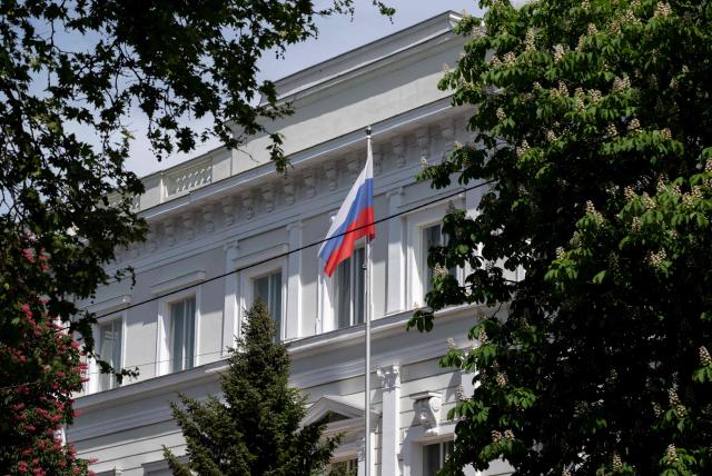 A Russian flag flies in front of the Embassy of the Russian Federation is seen in Vienna, Austria on May 4, 2026. Austria said it had expelled three Russian embassy staff on suspicion of spying, with the foreign minister vowing a "change of course" and a crackdown on espionage. The Russian embassy said there would be a "harsh" response. (Photo by Joe Klamar / AFP)