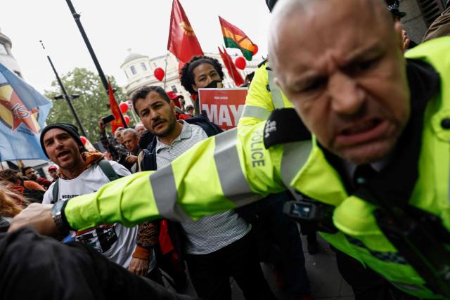 Police and protesters face off during a May Day march and rally in central London on May 4, 2026, to mark the 100th anniversary of the "General Strike" in 1926. (Photo by Brook Mitchell / AFP)