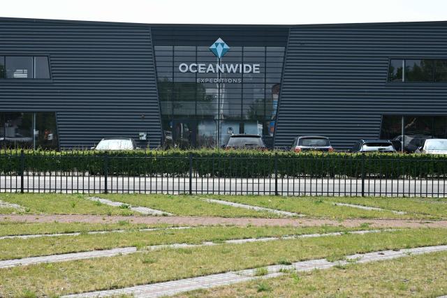 This photograph shows the logo of Oceanwide Expeditions at the headquarters in Vlissingen on May 4, 2026. Strict precautionary measures including isolation are in place on a cruise ship anchored off Cape Verde on which a suspected outbreak of hantavirus has killed three people, the cruise operator  said on May 4, 2026. (Photo by Nicolas TUCAT / AFP)