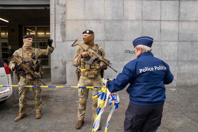 Soldiers and police stand guard in front of the Gare du Midi, Brussels South railway station, where the traffic has been suspended after a suspect package was found in Brussels on May 4, 2026. (Photo by Marius BURGELMAN / Belga / AFP) / Belgium OUT