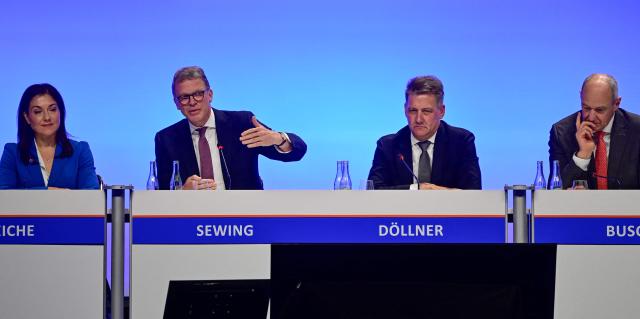 (L-R) German Economy and Energy Minister Katherina Reiche, Deutsche Bank CEO Christian Sewing, Gernot Doellner, Chairman of the Board of Management of AUDI AG and Siemens CEO Roland Busch take part in a panel discussion during the economic policy summit (Wirtschaftstag) in Berlin on May 4, 2026. The two-day summit brings together key players from politics and business. (Photo by John MACDOUGALL / AFP)