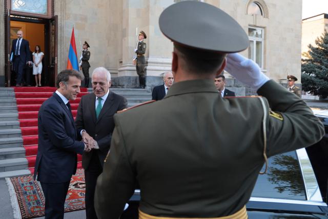 France's President Emmanuel Macron leaves after a meeting with Armenia's President Vahagn Khachaturyan at the presidential palace in Yerevan on May 4, 2026. (Photo by Ludovic MARIN / AFP)