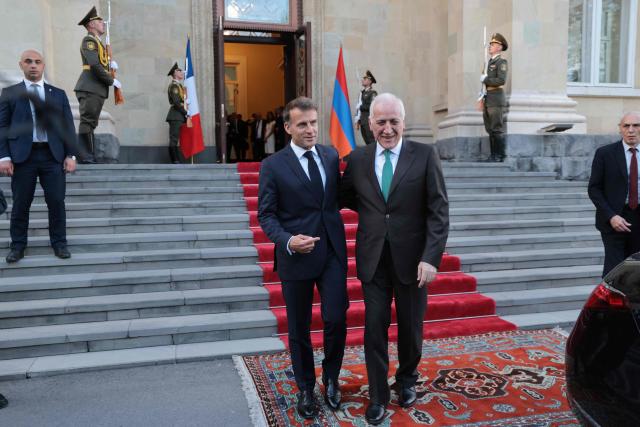 France's President Emmanuel Macron leaves after a meeting with Armenia's President Vahagn Khachaturyan at the presidential palace in Yerevan on May 4, 2026. (Photo by Ludovic MARIN / AFP)
