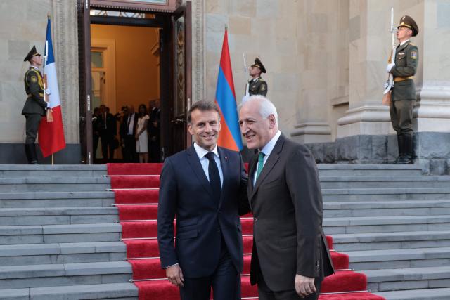 France's President Emmanuel Macron leaves after a meeting with Armenia's President Vahagn Khachaturyan at the presidential palace in Yerevan on May 4, 2026. (Photo by Ludovic MARIN / AFP)