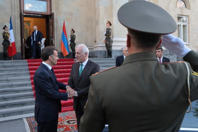 France's President Emmanuel Macron leaves after a meeting with Armenia's President Vahagn Khachaturyan at the presidential palace in Yerevan on May 4, 2026. (Photo by Ludovic MARIN / AFP)