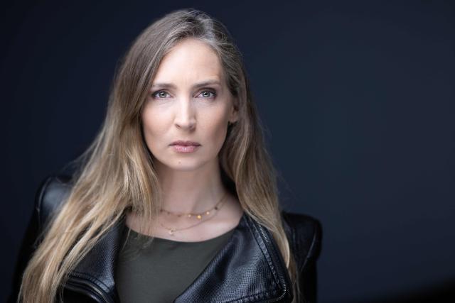 (FILES) Former French model Juliette G. poses during a photo session in Paris on March 10, 2026. Former French model Juliette G. says it took her years to make sense of how she ended up in a New York bedroom with convicted sex offender Jeffrey Epstein. The 43-year-old is one of two ex-models who have accused Daniel Siad, a French modelling scout with close ties to the late US financier, of having groomed them with the aim of introducing them to potential abusers. (Photo by JOEL SAGET / AFP)