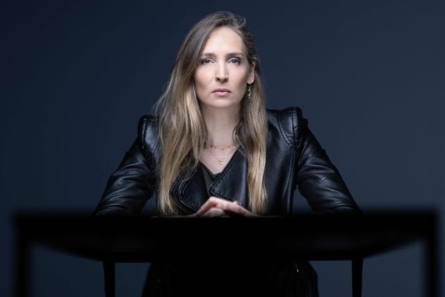 (FILES) Former French model Juliette G. poses during a photo session in Paris on March 10, 2026. Former French model Juliette G. says it took her years to make sense of how she ended up in a New York bedroom with convicted sex offender Jeffrey Epstein. The 43-year-old is one of two ex-models who have accused Daniel Siad, a French modelling scout with close ties to the late US financier, of having groomed them with the aim of introducing them to potential abusers. (Photo by JOEL SAGET / AFP)