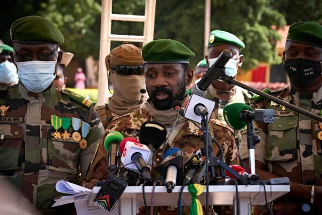 (FILES) Colonel Assimi Goita (C), President of CNSP (National Committee for the Salvation of People) addresses to the press during the ceremony of the 60th anniversary of Mali's independence in Bamako, on September 22, 2020, one day after announcing that the transitional presidency would be assigned to a retired colonel, Bah Ndaw, 70 years, ephemeral Minister of Defence in 2014. Mali's junta leader, Assimi Goïta, will assume the additional role of defence minister, according to a decree read on state TV on May 4, 2026, following the death of the previous minister in large-scale attacks.
Mali is facing a security crisis after an assault led by Tuareg separatists and Al-Qaeda-linked jihadists on several junta strongholds more than a week ago, during which Defence Minister Sadio Camara was killed by a car bomb at his residence. (Photo by MICHELE CATTANI / AFP)