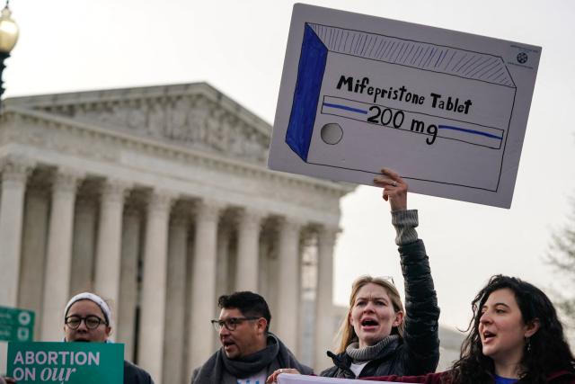 (FILES) Abortion rights activists rally in front of the US Supreme Court on March 26, 2024, in Washington, DC. The US Supreme Court on May 4, 2026, temporarily lifted a lower court's ban on mail delivery of the widely used abortion drug mifepristone. The court order restores mail access to mifepristone, which is used in the majority of abortions in the United States, until at least May 11. (Photo by Drew ANGERER / AFP)