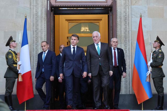 France's President Emmanuel Macron leaves after a meeting with Armenia's President Vahagn Khachaturyan at the presidential palace in Yerevan on May 4, 2026. (Photo by Ludovic MARIN / AFP)