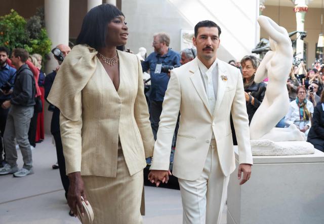 (L/R) US former tennis player Serena Williams and husband and Reddit co-founder Alexis Ohanian arrive for the press preview of the 2026 Met Gala celebrating "Costume Art" at the Metropolitan Museum of Art in New York City on May 4, 2026. Jeff Bezos and his wife Lauren Sanchez Bezos are lead sponsors and honorary co-chairs of the high-profile fundraising event which draws A-listers across entertainment, sport, fashion and business. (Photo by TIMOTHY A. CLARY / AFP)