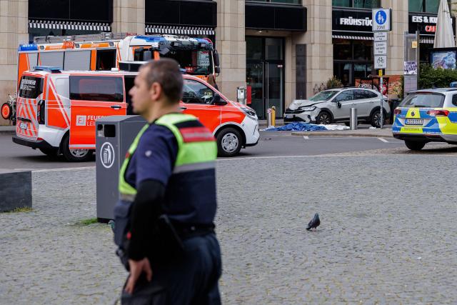 Members of the emergency services work at the scene where a car ploughed into people on a street leaving at least two dead and several injured, in the city centre in Leipzig, eastern Germany on May 4, 2026. Leipzig mayor Burkhard Jung confirmed the deaths, adding nothing was known about the motive of the vehicle driver. Police said the driver had been arrested and no longer posed a danger. (Photo by Jens SCHLUETER / AFP)