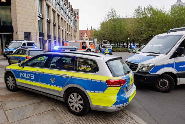 Police cordon off the area after a car ploughed into people on a street leaving at least two dead and several injured, in the city centre in Leipzig, eastern Germany on May 4, 2026. Leipzig mayor Burkhard Jung confirmed the deaths, adding nothing was known about the motive of the vehicle driver. Police said the driver had been arrested and no longer posed a danger. (Photo by Jens SCHLUETER / AFP)