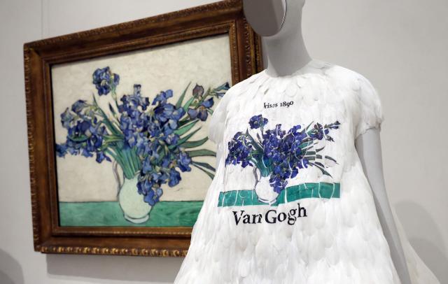 A fashion design is exhibited next to the 1890 painting "Irises" by Vincent van Gogh during the press preview of the 2026 Met Gala celebrating "Costume Art" at the Metropolitan Museum of Art in New York City on May 4, 2026. Jeff Bezos and his wife Lauren Sanchez Bezos are lead sponsors and honorary co-chairs of the high-profile fundraising event which draws A-listers across entertainment, sport, fashion and business. (Photo by TIMOTHY A. CLARY / AFP)