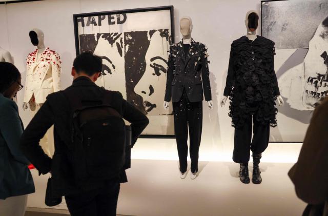 People attend an exhibition of fashion designs during the press preview of the 2026 Met Gala celebrating "Costume Art" at the Metropolitan Museum of Art in New York City on May 4, 2026. Jeff Bezos and his wife Lauren Sanchez Bezos are lead sponsors and honorary co-chairs of the high-profile fundraising event which draws A-listers across entertainment, sport, fashion and business. (Photo by TIMOTHY A. CLARY / AFP)