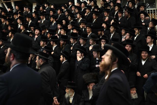 Ultra-Orthodox Jewish men gather at the Mea Shearim neighbourhood as they celebrate the Jewish holiday of Lag BaOmer in Jerusalem on May 4, 2026. Lag BaOmer marks the anniversary of the death of Talmudic sage Rabbi Shimon Bar Yochai approximately 1,900 years ago. (Photo by Ilia YEFIMOVICH / AFP)