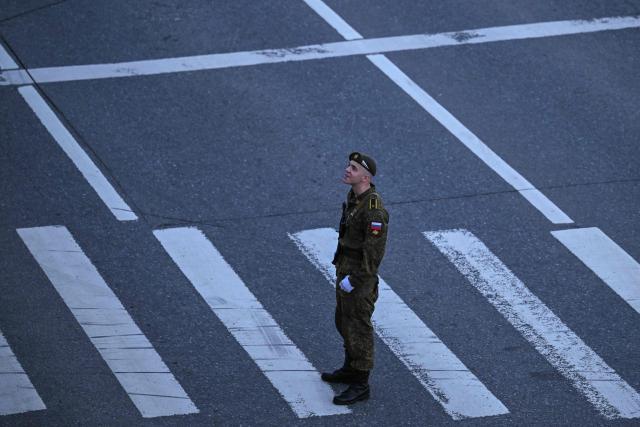 Russian serviceman awaits the rehearsal of the Victory Day military parade, to be held at Red Square, in central Moscow on May 4, 2026. Russia declared on May 4 a unilateral ceasefire with Ukraine between May 8-9, when Moscow marks its annual World War II Victory Day commemorations, and threatened a "massive missile strike" on Kyiv if Ukraine violated it. (Photo by Igor IVANKO / AFP)