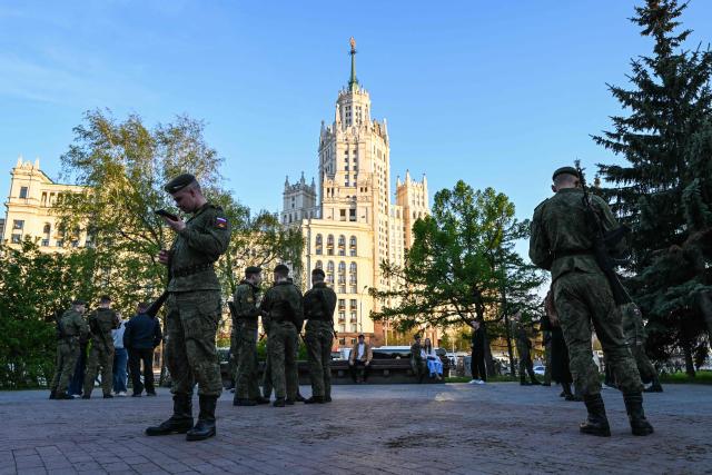 Russian servicemen stand on the sidelines of the rehearsal of the Victory Day military parade, to be held at Red Square, in central Moscow on May 4, 2026. Russia declared on May 4 a unilateral ceasefire with Ukraine between May 8-9, when Moscow marks its annual World War II Victory Day commemorations, and threatened a "massive missile strike" on Kyiv if Ukraine violated it. (Photo by Igor IVANKO / AFP)