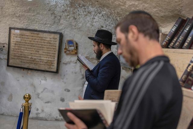 Ultra Orthodox Jews praying at the tomb of “Shimon Hazadik” (Simeon the Just) as they celebrate the Jewish holiday of Lag BaOmer in the east Jerusalem neighborhood of Sheikh Jarrah on May 4, 2026. Lag BaOmer marks the anniversary of the death of Talmudic sage Rabbi Shimon Bar Yochai approximately 1,900 years ago. (Photo by ilia YEFIMOVICH / AFP)