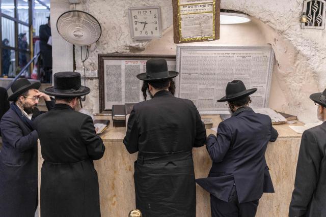 Ultra Orthodox Jews praying at the tomb of “Shimon Hazadik” (Simeon the Just) as they celebrate the Jewish holiday of Lag BaOmer in the east Jerusalem neighborhood of Sheikh Jarrah on May 4, 2026. Lag BaOmer marks the anniversary of the death of Talmudic sage Rabbi Shimon Bar Yochai approximately 1,900 years ago. (Photo by ilia YEFIMOVICH / AFP)