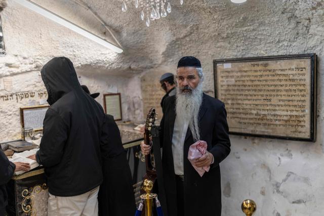 Ultra Orthodox Jews praying at the tomb of “Shimon Hazadik” (Simeon the Just) as they celebrate the Jewish holiday of Lag BaOmer in the east Jerusalem neighborhood of Sheikh Jarrah on May 4, 2026. Lag BaOmer marks the anniversary of the death of Talmudic sage Rabbi Shimon Bar Yochai approximately 1,900 years ago. (Photo by ilia YEFIMOVICH / AFP)