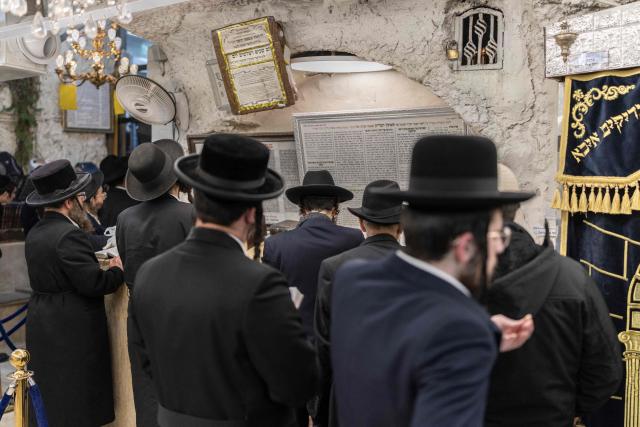 Ultra Orthodox Jews praying at the tomb of “Shimon Hazadik” (Simeon the Just) as they celebrate the Jewish holiday of Lag BaOmer in the east Jerusalem neighborhood of Sheikh Jarrah on May 4, 2026. Lag BaOmer marks the anniversary of the death of Talmudic sage Rabbi Shimon Bar Yochai approximately 1,900 years ago. (Photo by ilia YEFIMOVICH / AFP)