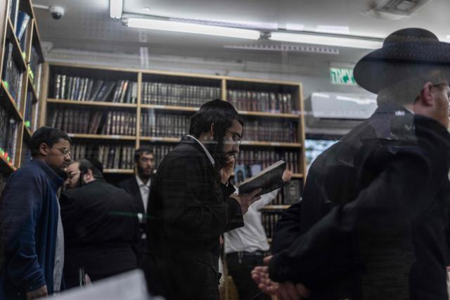 Ultra Orthodox Jews praying at the tomb of “Shimon Hazadik” (Simeon the Just) as they celebrate the Jewish holiday of Lag BaOmer in the east Jerusalem neighborhood of Sheikh Jarrah on May 4, 2026. Lag BaOmer marks the anniversary of the death of Talmudic sage Rabbi Shimon Bar Yochai approximately 1,900 years ago. (Photo by ilia YEFIMOVICH / AFP)