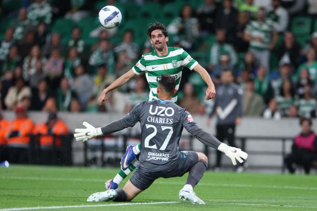 Sporting Lisbon's Portuguese forward #17 Francisco Trincao attempts to score past Vitoria Guimaraes's Brazilian goalkeeper # 27 Charles during the Portuguese League football match between Sporting CP and Vitoria Guimaraes SC at Jose Alvalade stadium in Lisbon, on May 4, 2026. (Photo by PATRICIA DE MELO MOREIRA / AFP)