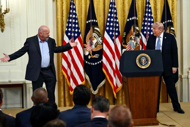 US President Donald Trump listens interacts with US businessman and reality TV star Rick Harrison as he participates in a Small Business Summit in the East Room of the White House in Washington, DC on May 4, 2026. (Photo by Kent NISHIMURA / AFP)