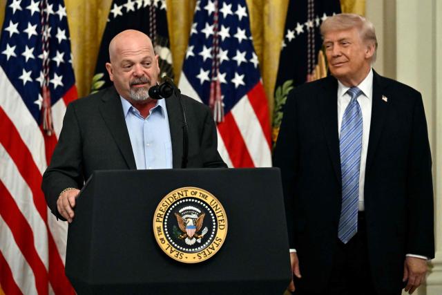 US President Donald Trump listens to US businessman and reality TV star Rick Harrison as he participates in a Small Business Summit in the East Room of the White House in Washington, DC on May 4, 2026. (Photo by Kent NISHIMURA / AFP)