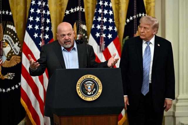 US President Donald Trump listens to US businessman and reality TV star Rick Harrison as he participates in a Small Business Summit in the East Room of the White House in Washington, DC on May 4, 2026. (Photo by Kent NISHIMURA / AFP)