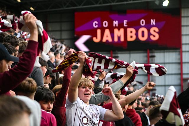 Hearts fans celebrate their team's first goal of the game during the Scottish Premiership football match between Hearts and Rangers at Tynecastle Stadium in Edinburgh on May 4, 2026. Hearts are hoping to become the first club other than Celtic and Rangers to win the Scottish crown since Aberdeen in 1985. (Photo by ANDY BUCHANAN / AFP)