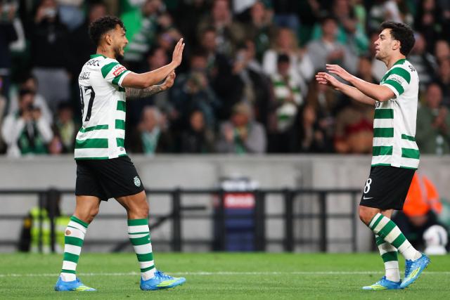 Sporting Lisbon's Colombian forward #97 Luis Suarez (L)  celebrates scoring his team's fourth goal during the Portuguese League football match between Sporting CP and Vitoria Guimaraes SC at Jose Alvalade stadium in Lisbon, on May 4, 2026. (Photo by PATRICIA DE MELO MOREIRA / AFP)