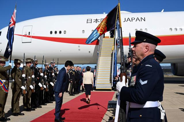 Japan’s Prime Minister Sanae Takaichi walks towards her aircraft at a Royal Australian Air Force base in Canberra on May 5, 2026, ahead of her departure following a three-day official visit to Australia. (Photo by Saeed KHAN / AFP)