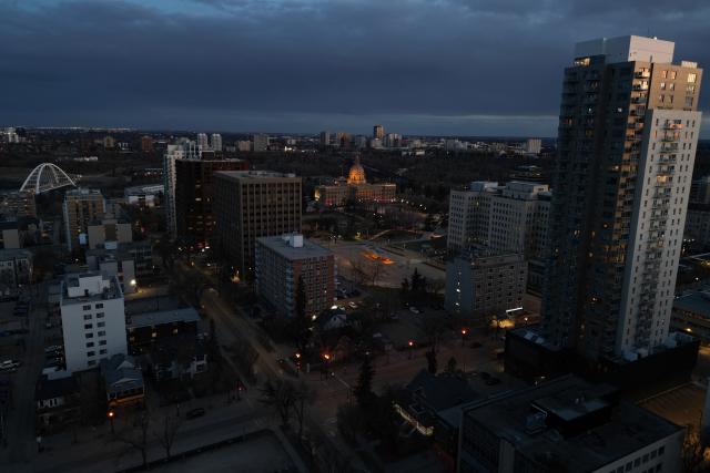 This aerial view shows the downtown skyline in Edmonton, Canada, at sunset on May 3, 2026. Separatists who want oil-rich Alberta to break away from Canada head to the provincial capital Edmonton on May 4, 2026 to submit a petition that they say has enough signatures to force a referendum. The pro-independence camp in the western province of five million people had existed on the margins for decades, but the movement has gathered pace in recent months and is closer than ever to triggering a vote. (Photo by Daphné LEMELIN / AFP)