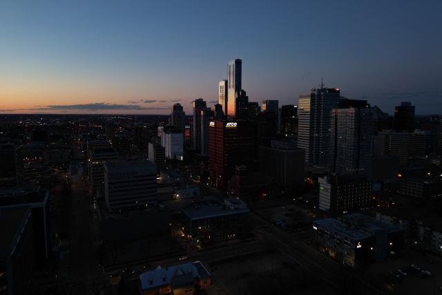 This aerial view shows the downtown skyline in Edmonton, Canada, at sunset on May 3, 2026. Separatists who want oil-rich Alberta to break away from Canada head to the provincial capital Edmonton on May 4, 2026 to submit a petition that they say has enough signatures to force a referendum. The pro-independence camp in the western province of five million people had existed on the margins for decades, but the movement has gathered pace in recent months and is closer than ever to triggering a vote. (Photo by Daphné LEMELIN / AFP)