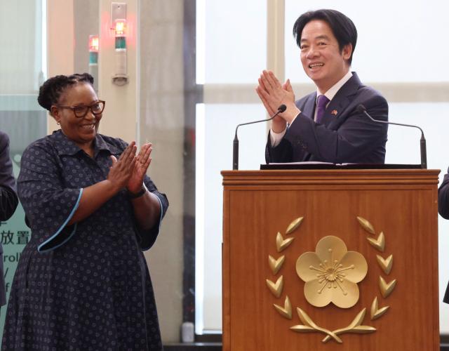 Taiwan President Lai Ching-te (R) and Eswatini Deputy Prime Minister Thulisile Dladla ?L) arrive at Taiwan Taoyuan International Airport following his visit to Eswatini, in Taoyuan on May 5, 2026. (Photo by I-Hwa Cheng / AFP)