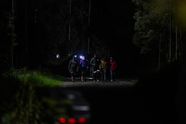 Miners walk around the site of an explosion at a coal mine in Sutatausa, Cundinamarca department, Colombia on May 4, 2026. Nine miners died and six others were rescued following an explosion at a legal coal mine in central Colombia on May 4, 2026, according to the final tally released by authorities at the end of the search operation. (Photo by Luis ACOSTA / AFP)