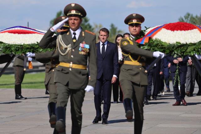 France's President Emmanuel Macron attends a ceremony to lay wreaths at the Tsitsernakaberd Armenian Genocide Memorial in Yerevan on May 5, 2026. (Photo by Ludovic MARIN / AFP)