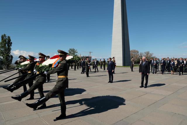 France's President Emmanuel Macron, Armenia's President Vahagn Khachaturyan and officials attend a ceremony to lay wreaths at the Tsitsernakaberd Armenian Genocide Memorial in Yerevan on May 5, 2026. (Photo by Ludovic MARIN / AFP)