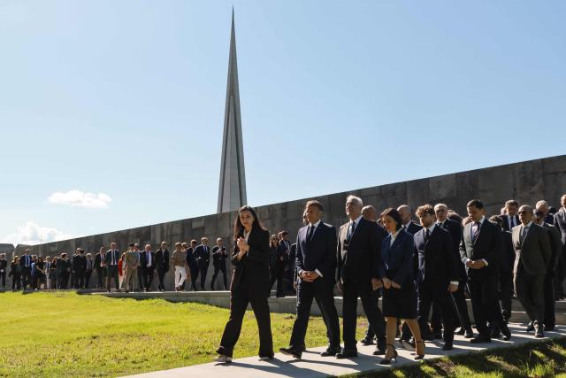 France's President Emmanuel Macron, Armenia's President Vahagn Khachaturyan and officials visit the Tsitsernakaberd Armenian Genocide Memorial in Yerevan on May 5, 2026. (Photo by Ludovic MARIN / AFP)