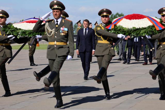 France's President Emmanuel Macron attends a ceremony to lay wreaths at the Tsitsernakaberd Armenian Genocide Memorial in Yerevan on May 5, 2026. (Photo by Ludovic MARIN / AFP)