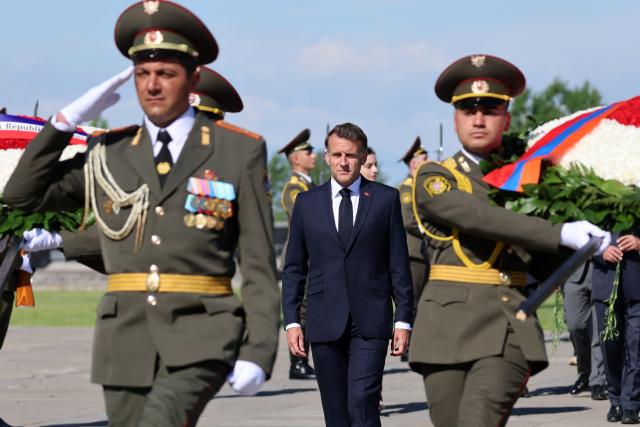 France's President Emmanuel Macron attends a ceremony to lay wreaths at the Tsitsernakaberd Armenian Genocide Memorial in Yerevan on May 5, 2026. (Photo by Ludovic MARIN / AFP)