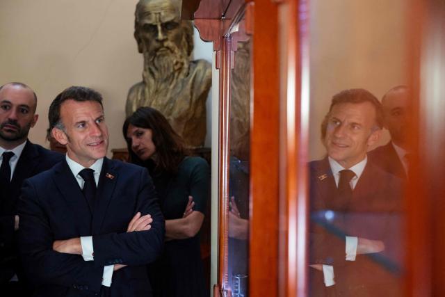 France's President Emmanuel Macron visits the Matenadaran museum, Armenia's cultural institution which houses the vast collection of ancient manuscripts, in Yerevan on May 5, 2026. (Photo by Ludovic MARIN / AFP)
