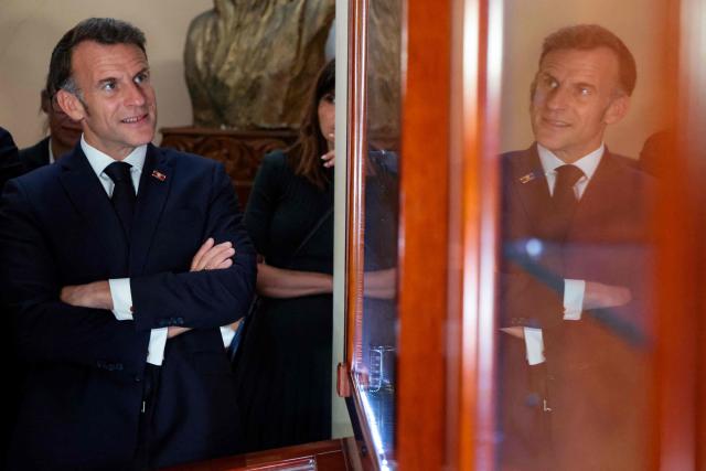 France's President Emmanuel Macron visits the Matenadaran museum, Armenia's cultural institution which houses the vast collection of ancient manuscripts, in Yerevan on May 5, 2026. (Photo by Ludovic MARIN / AFP)