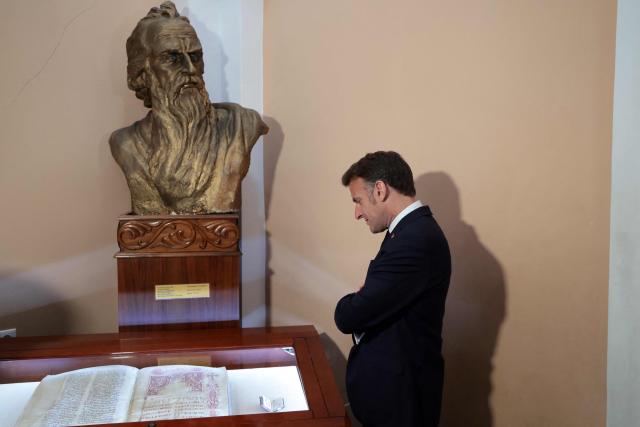 France's President Emmanuel Macron visits the Matenadaran museum, Armenia's cultural institution which houses the vast collection of ancient manuscripts, in Yerevan on May 5, 2026. (Photo by Ludovic MARIN / AFP)