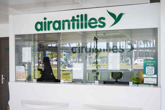 This photograph taken in Les Abymes, on the French Caribbean island of Guadeloupe on April 30, 2026, shows a closed office of French regional airline Air Antilles at Maryse Conde airport's regional terminal. The regional airline, which had been serving the French Caribbean islands (Saint Barthélemy, Saint Martin, Guadeloupe and Martinique) since 2002, had been facing a series of setbacks for several years. On April 27, 2026, the Commercial Court of Pointe-à-Pitre (Guadeloupe) placed Air Antilles into administration, due to the lack of a takeover bid deemed credible. (Photo by Carla Bernhardt / AFP)
